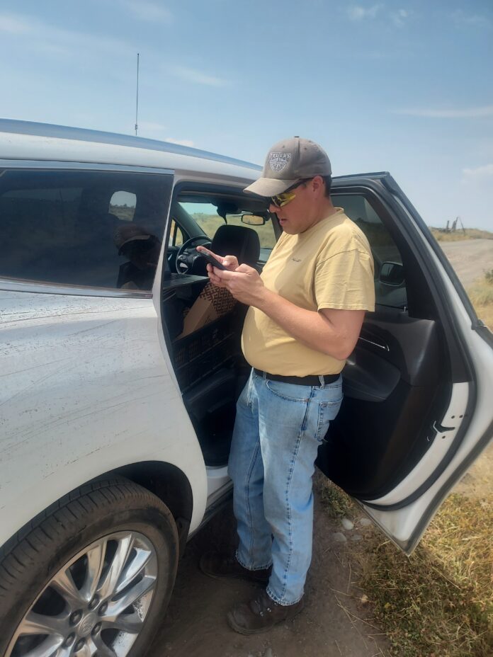 Mike researching where we need to go to get to the site.
