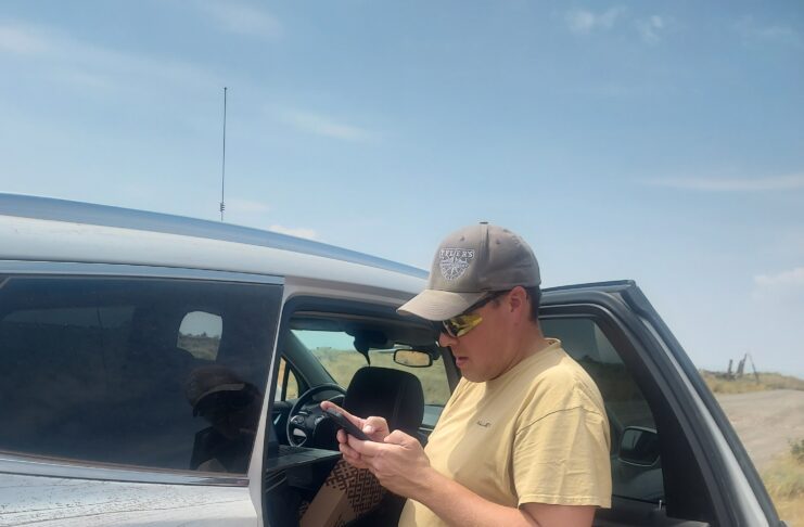 Mike researching where we need to go to get to the site.